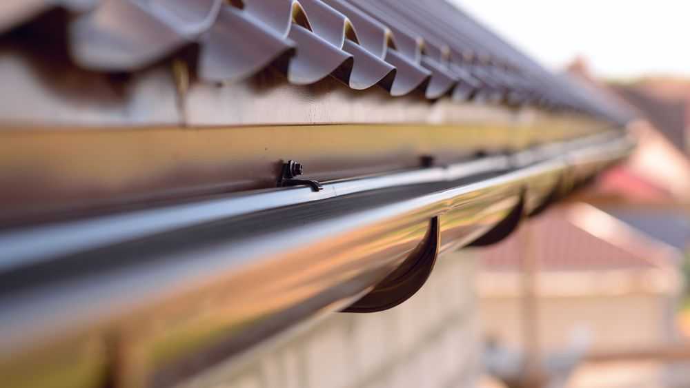 new gutter installation on side of roof